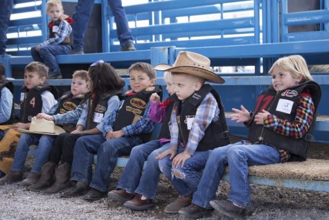 Kids participating in the mutton bustin' event wait to be fitted with helmets during the Tucson Rodeo in Tucson, AZ 2019.