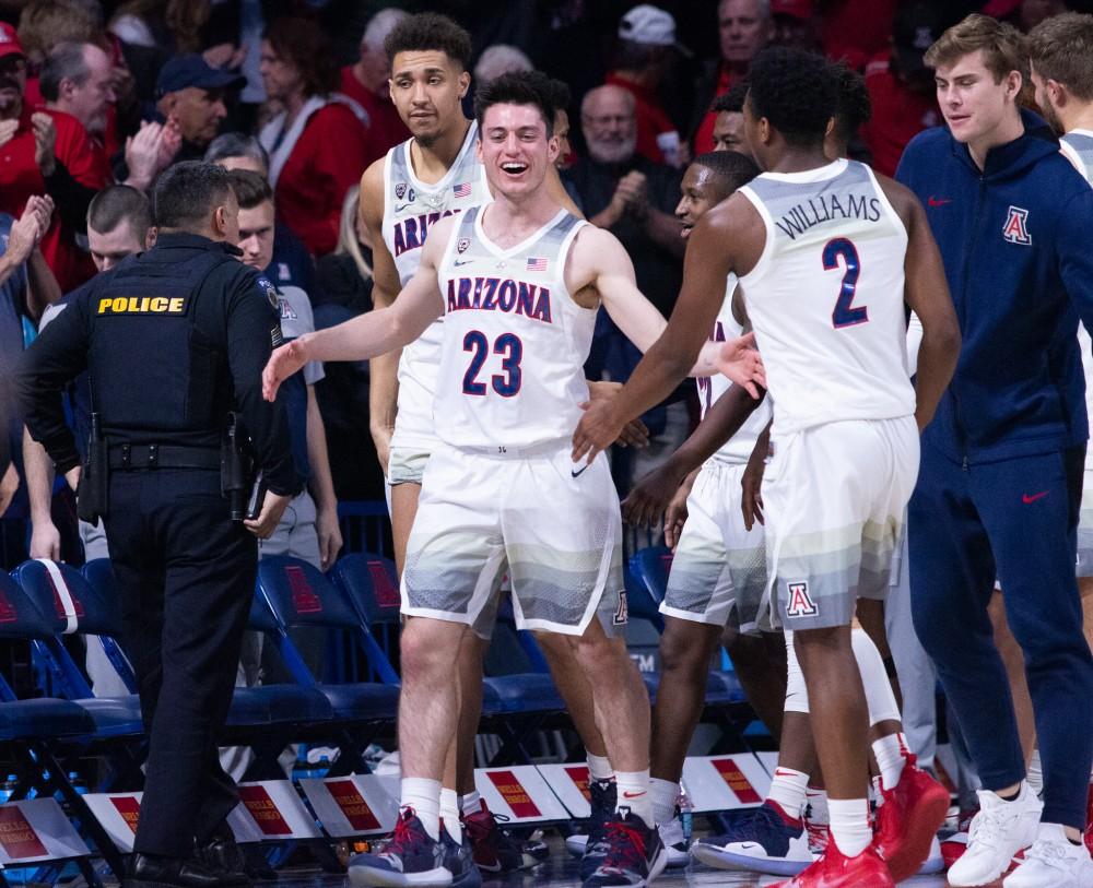 The team celebrates after beating Stanford on Sunday, Feb. 24 at McKale Center. The final score was 70-54. 