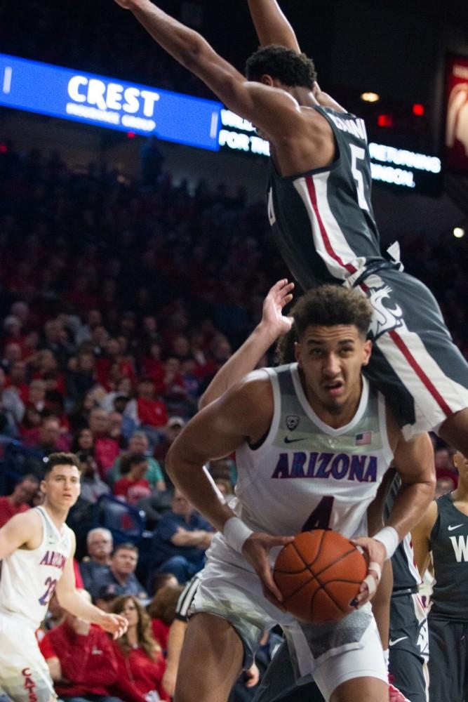 Washington State University's Marvin Cannon (5) jumps over Chase Jeter (4) during the game on Saturday, Feb. 9 at McKale Center. Arizona lost 69-55. 