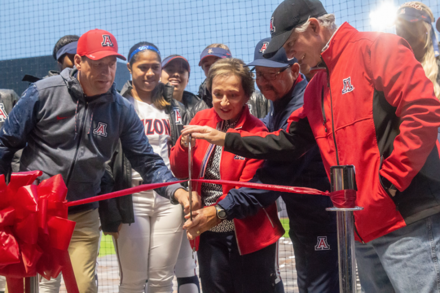  During the opening ceremony of the new Hillenbrand stadium, head coach Mike Candrea cuts celebratory ribbon. Due to rain the first softball game of the season was cancelled.  