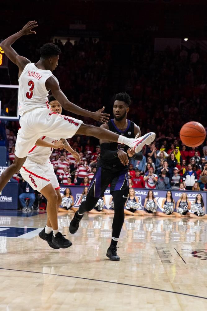 Guard Dylan Smith (3) tries to block a pass during the game against Washington on Thursday, Feb. 7 at McKale Center. Washington beat Arizona with a final score of 67-60. 