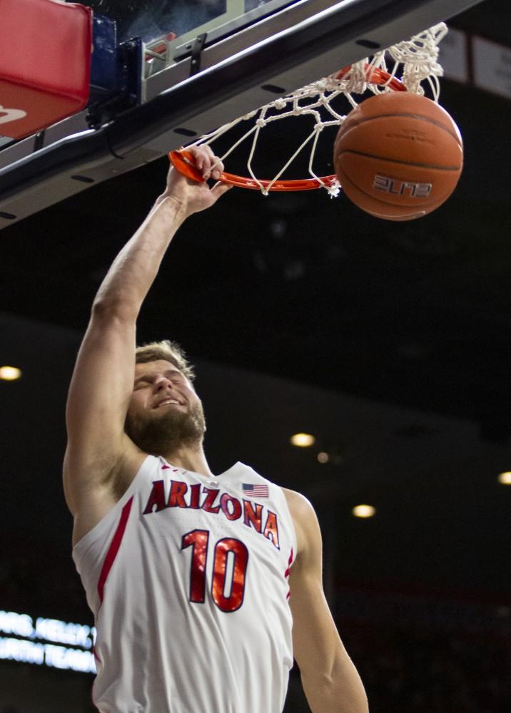 Arizona's Ryan Luther (10) follows through a dunk during the Arizona-California game on Thursday, Feb. 21, 2019 at the McKale Center in Tucson, Ariz.