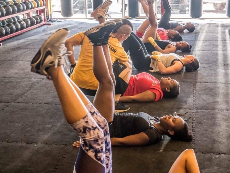 While doing leg lifts, members of the Black Girls Fitness Club do a variety of workouts that focus on strengthen their core, arms, and legs.  