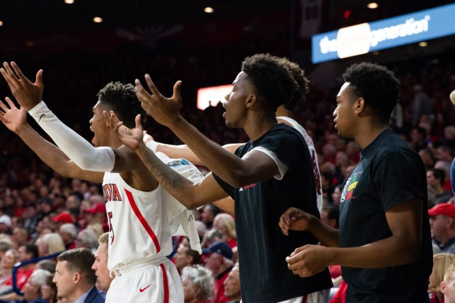 Players watching from the sidelines react to a call from the ref during the game against Washington on Thursday, Feb. 5 at McKale Center. Arizona was defeated by Washington 67-60. 