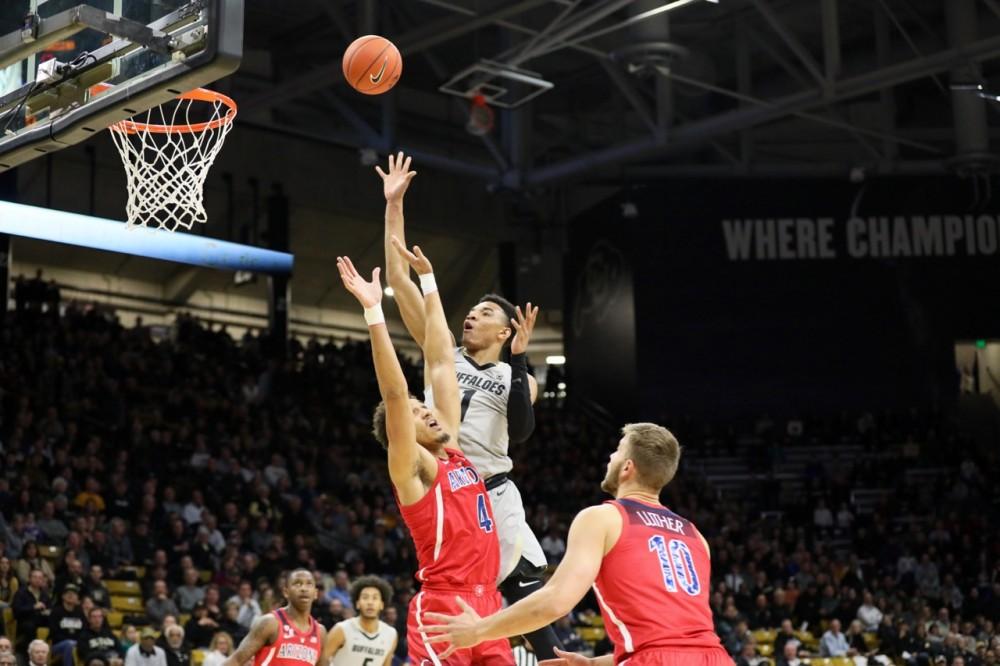 Colorado's Tyler Bey (1) attempts a floater over Arizona's Chase Jeter (4) during the Arizona-Colorado game in Boulder, CO on Feb. 17.