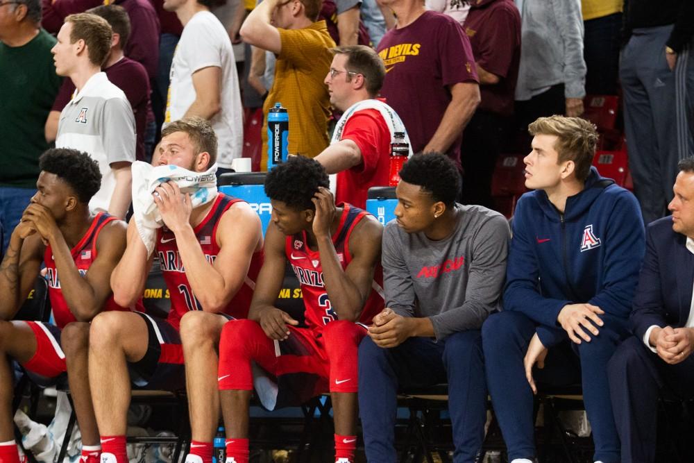 The Arizona basketball team watches the game against ASU on the sidelines on Thursday, Jan. 31 at Wells Fargo Arena. Arizona lost 95-88. 