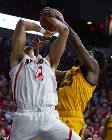 Arizona's Chase Jeter (4) get fouled going up for a lay up during the Arizona-Arizona State game on Saturday, March 9, 2019 at the McKale Center in Tucson, Ariz.