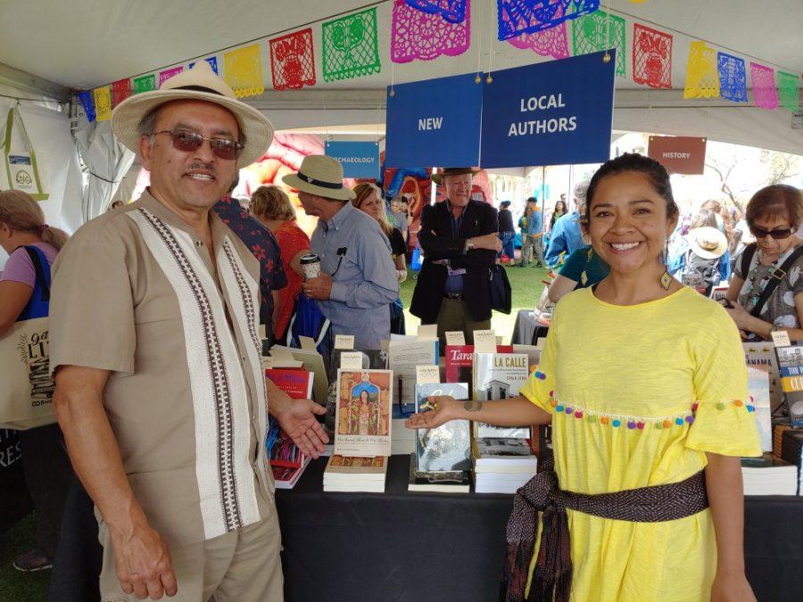 UA professor of Mexican American Studies Roberto Rodriguez (left) and Mayan musician and educator Yazmin Novelo (left) attend the Tucson Festival of Books on the University of Arizona Mall.