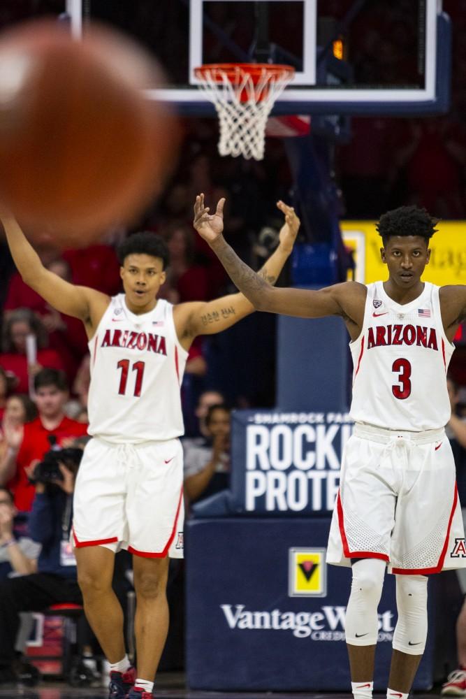 Arizona's Ira Lee (11) and Dylan Smith (3), celebrate teammate Ryan Luther's three during the Arizona-Arizona State game on Saturday, March 9, 2019 at the McKale Center in Tucson, Ariz.