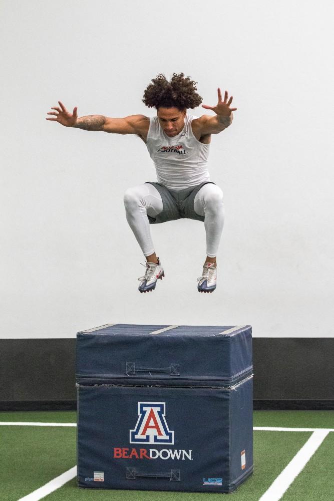 Shawn Poindexter shows off his vertical leap in some box jumps as he warms up for running sprints on Tuesday, March 12th. 