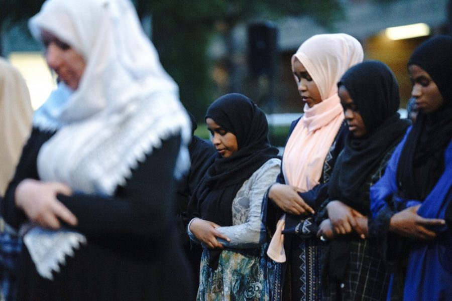 Muslim women praying at the Christchurch vigil at the University of Arizona on Mar. 20.