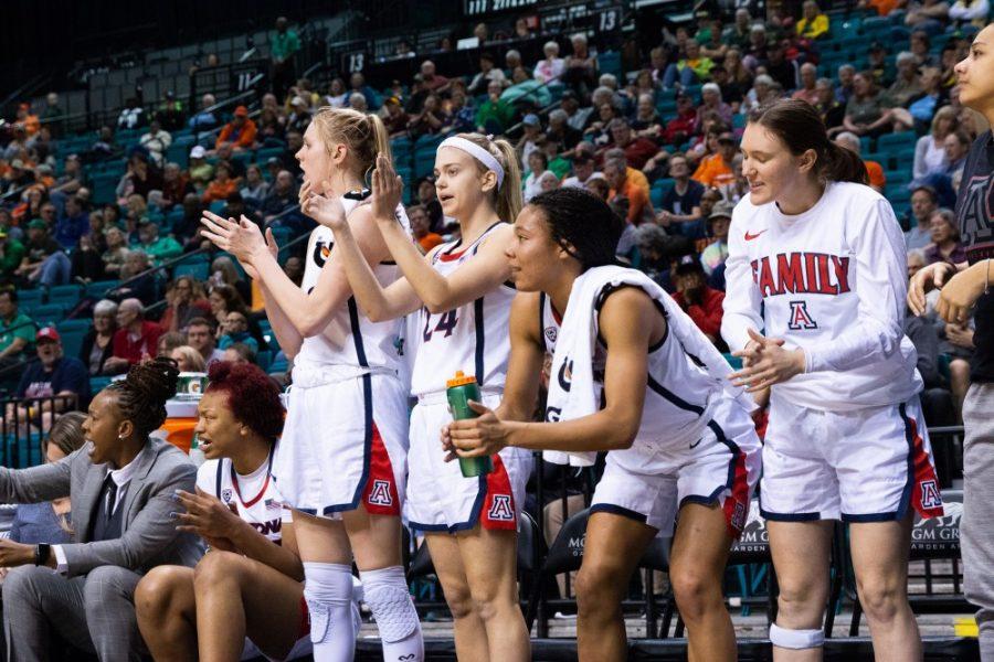 Players on the bench cheer on their teammates during the game against USC in the first round of the Pac-12 tournament on Thursday, March 7 at the Grand Garden Arena in Las Vegas, Nevada. Arizona defeated USC 76-48. 