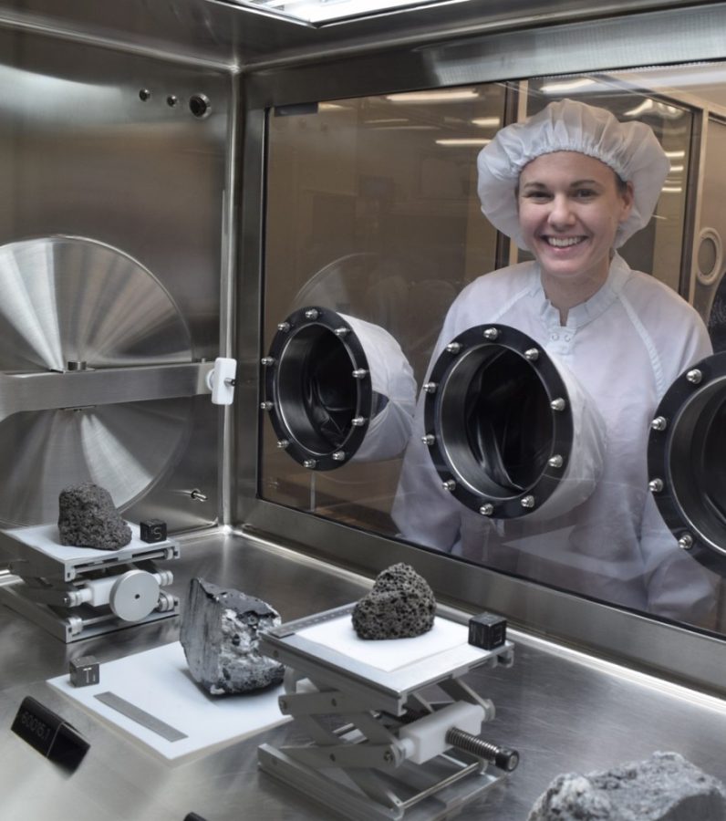 Incoming UA assistant professor Jessica Barnes stands behind samples of moon rocks taken during the Apollo 17 mission in 1972. After over 40 years, she and her team will get a chance to study the samples.