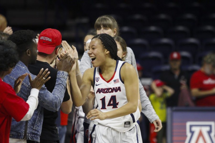 Arizonas+sophomore+forward%2C+Sam+Thomas+high-fiving+fans+after+the+game+against+the+Pacific+Tigers+on+Sunday%2C+March+24%2C+2019.+The+final+score+of+the+game+was+64-48%2C+a+win+for+the+Wildcats.+