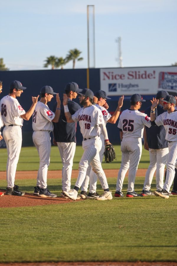 Tucson Ariz.- Arizona team congratulating each other after there second wins against Washington on Saturday April 6, 2019. The cats defeated the huskies, 14-2.