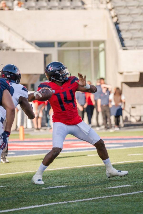 Photo by Beau Leone. Quarterback Khalil Tate launches a ball downfield before connecting with wide receiver Devaughn Cooper for an 83 yard touchdown.  