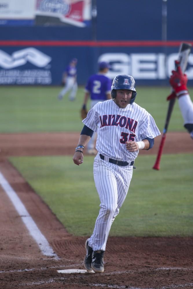 Tucson Ariz.- Infielder, Cameron Cannon (35) scoring a run on Saturday April 6, 2019. The cats defeated the huskies, 14-2.
