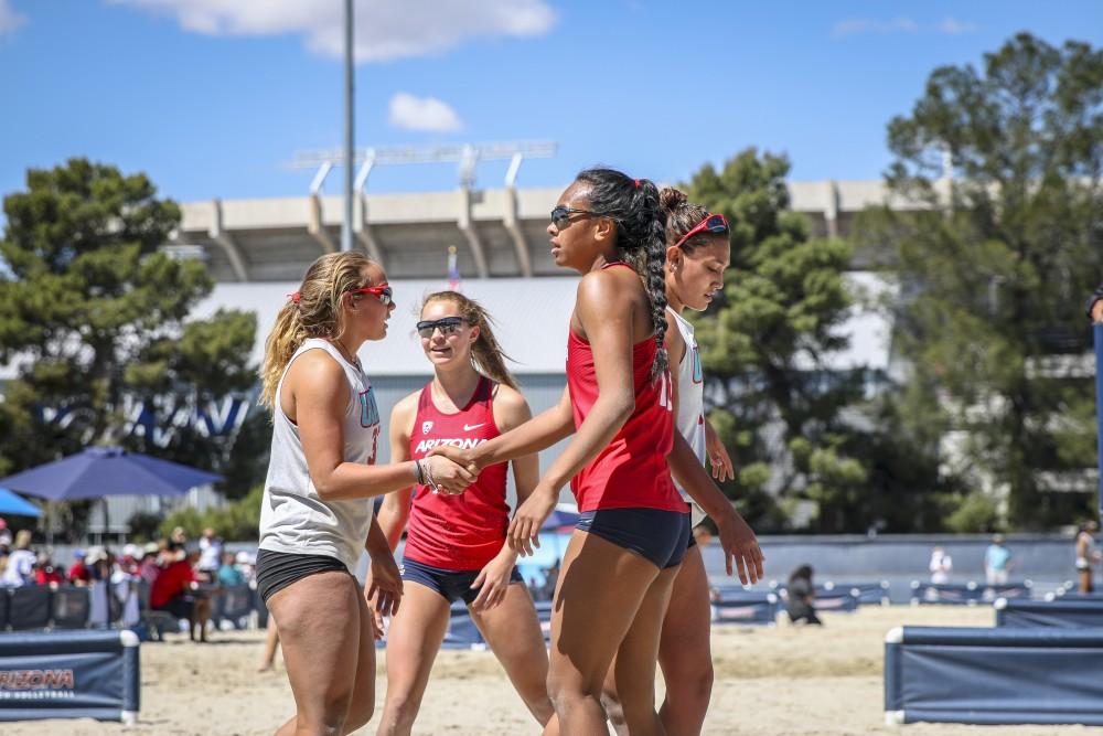 Dana Parker (12) and Ainise Havili (13) shaking hands after their win on April 13 at Bear Down Bear, in Tucson, Ariz. Arizona wins 4-1 against New Mexico