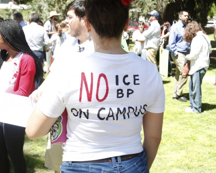 A coalition of silent protesters walked down University Boulevard to hand deliver letters to President Robbins on Wednesday, April 10, 2019, explaining their frustrations with the charges against the Arizona 3 regarding the students who are being criminally charged after an incident with Border Patrol on March 19. Members of the protest wore shirts with No ICE/ BP on Campus written on them.