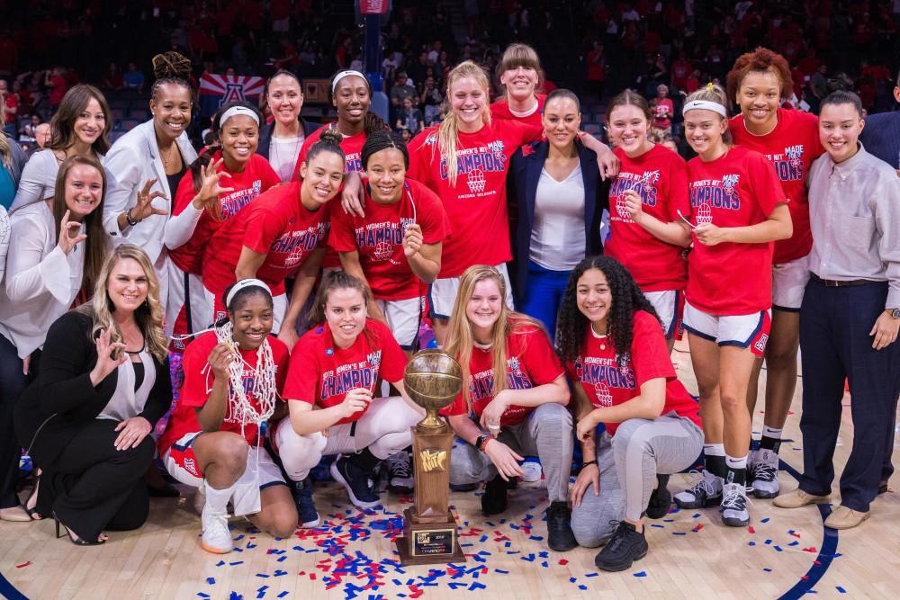 The Arizona Women's Basketball team poses with their trophy after defeating Northwestern in the WNIT Championship by winning 56-42