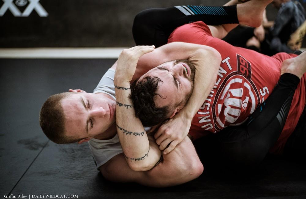 Noah Pittenger grappling with a partner in his jiu jitsu studio on Mar. 28 in Tucson, Ariz.