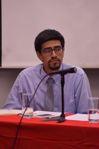 Member of the University of Arizona Debate Series Juan Torres listening to his opponent during the debate on April 9 covering whether community college should be tuition free. The debate series is hosted by the College of Social and Behavioral Sciences.