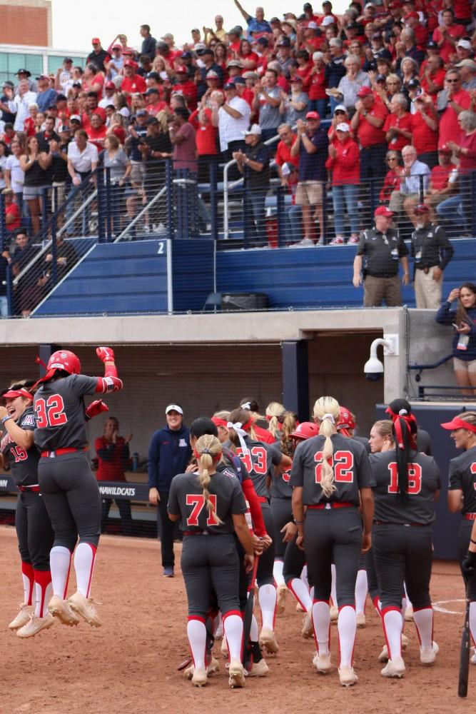 The Arizona softball team and crowd celebrates after Alyssa' Palomino's home run against Auburn in the Tucson Regional Championship at Hillenbrand Stadium on May 19. 