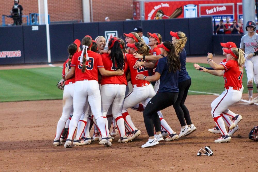 The Arizona softball team celebrates after beating Ole Miss 9-1 to advance to the Women's College World Series.