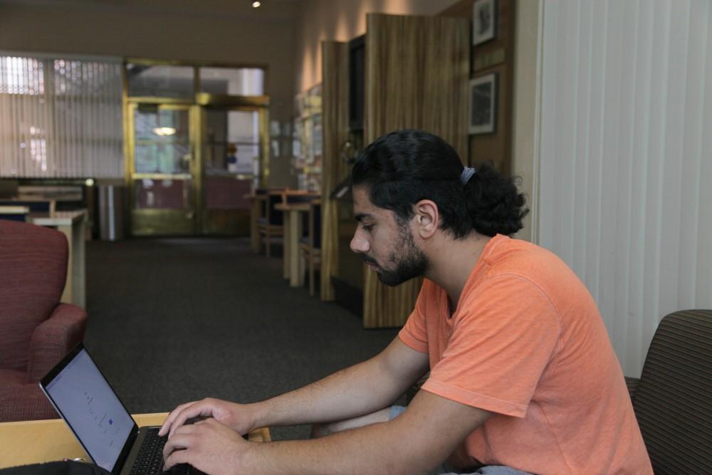 Mahmoud Wahab studies in the U.S.S Arizona Lounge. He likes this room because it is discreet and quiet.
