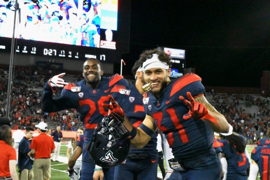 Wildcats Tristan cooper (31) and Samari Springs (29) are all smiles after winning their first PAC 12 game of the season. 