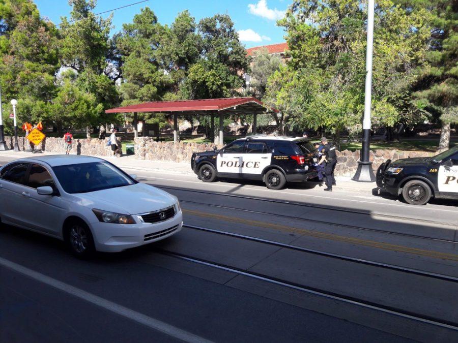 Two Tucson Police Department cars sit outside Panera Bread after an attempted bike thief was apprehended with civilian help. According to one involved party, the alleged thief had a gun, but this has not been confirmed by TPD.