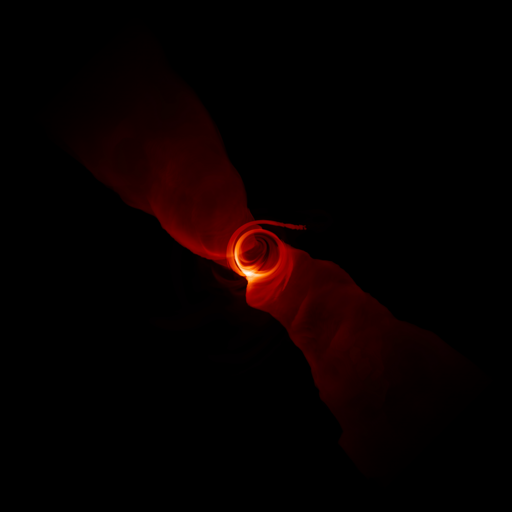  A simulated image by the University of Arizona shows the turbulent plasma in the extreme environment around a supermassive black hole. 