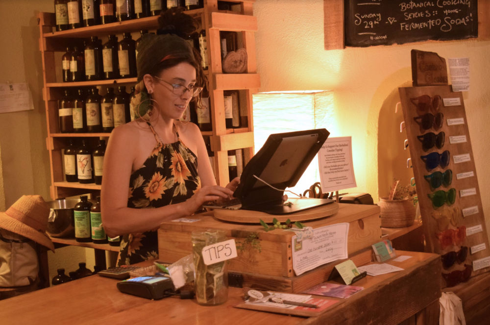 Ash Ritter, one of the employees at Tucson Herb Store on Fourth Avenue in Downtown Tucson during her shift. Tucson Herb Store has been open since 2003.