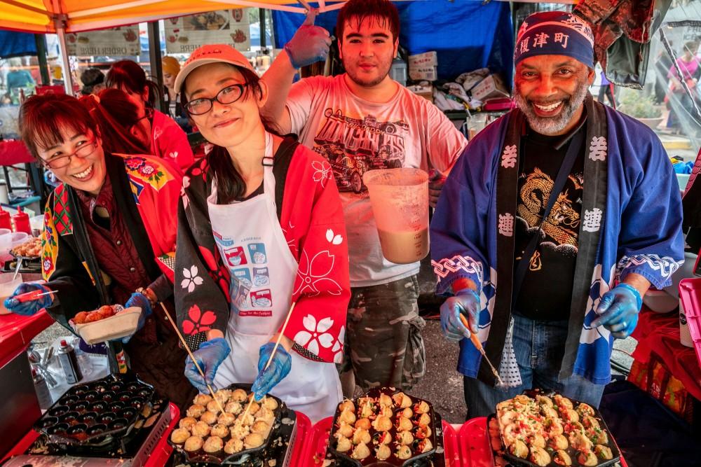 One vendor prepares takoyaki balls, a Japanese snack. Tucson Meet Yourself brings together local vendors of a wide variety of cultures, gathering in a folk life celebration on October 11-13.