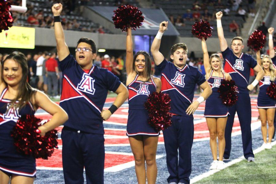 Members of the Arizona Cheer team perform during the opening number of Fight Wildcats Fight. 