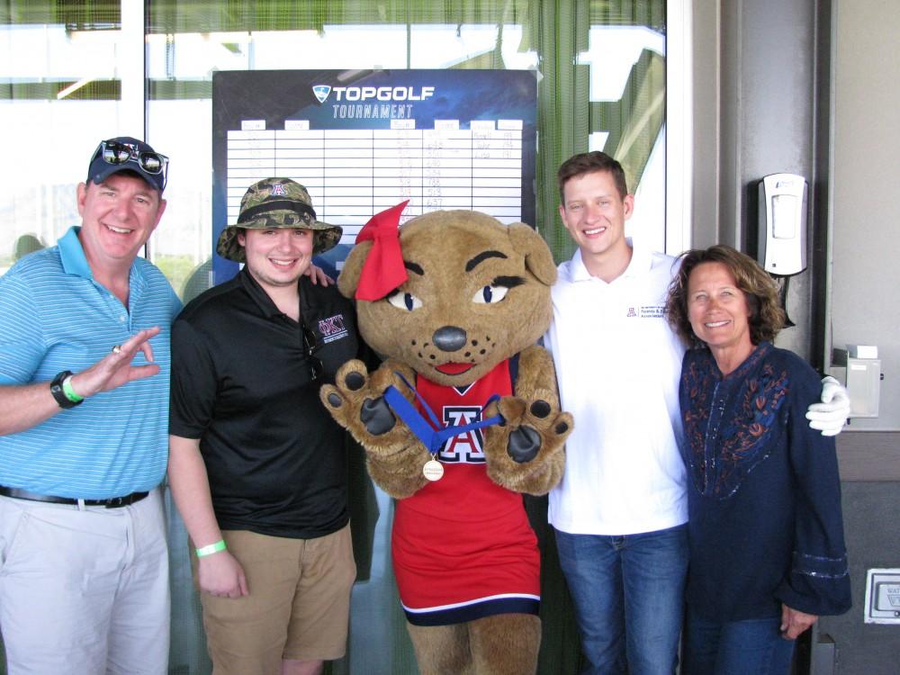 Some of last year's golf challenge attendees pose with Wilma. This year, the profits from the golf challenge will be donated to the UA Campus Pantry.