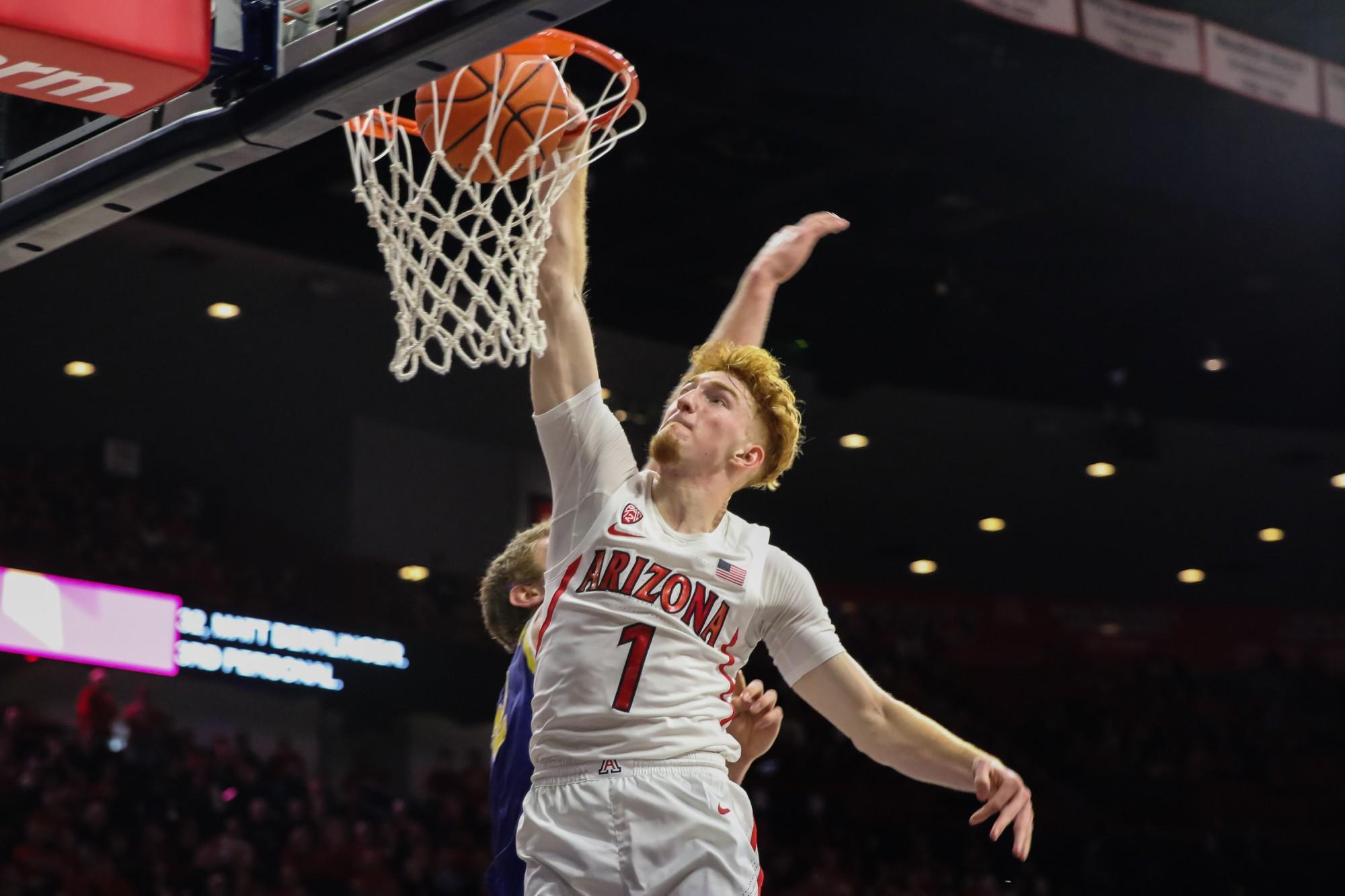 Nico Mannion (1) dunks the ball into the basket during the last few minutes of the Arizona-South Dakota State game in the McKale Center on Thursday November 21. The Wildcats continue their winning streak by defeating the Jackrabbits 71-64.