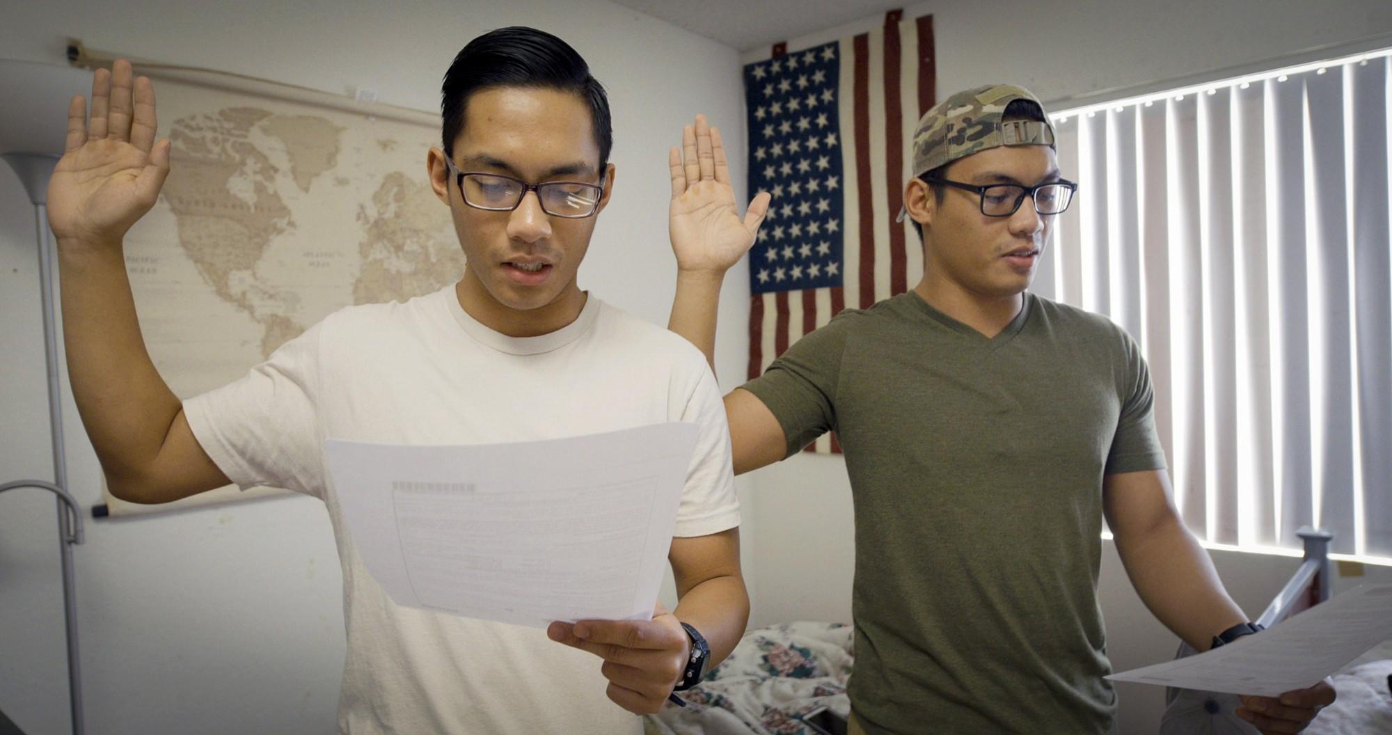 James and John Sena read their Oath of Enlistment for the U.S. Army.
