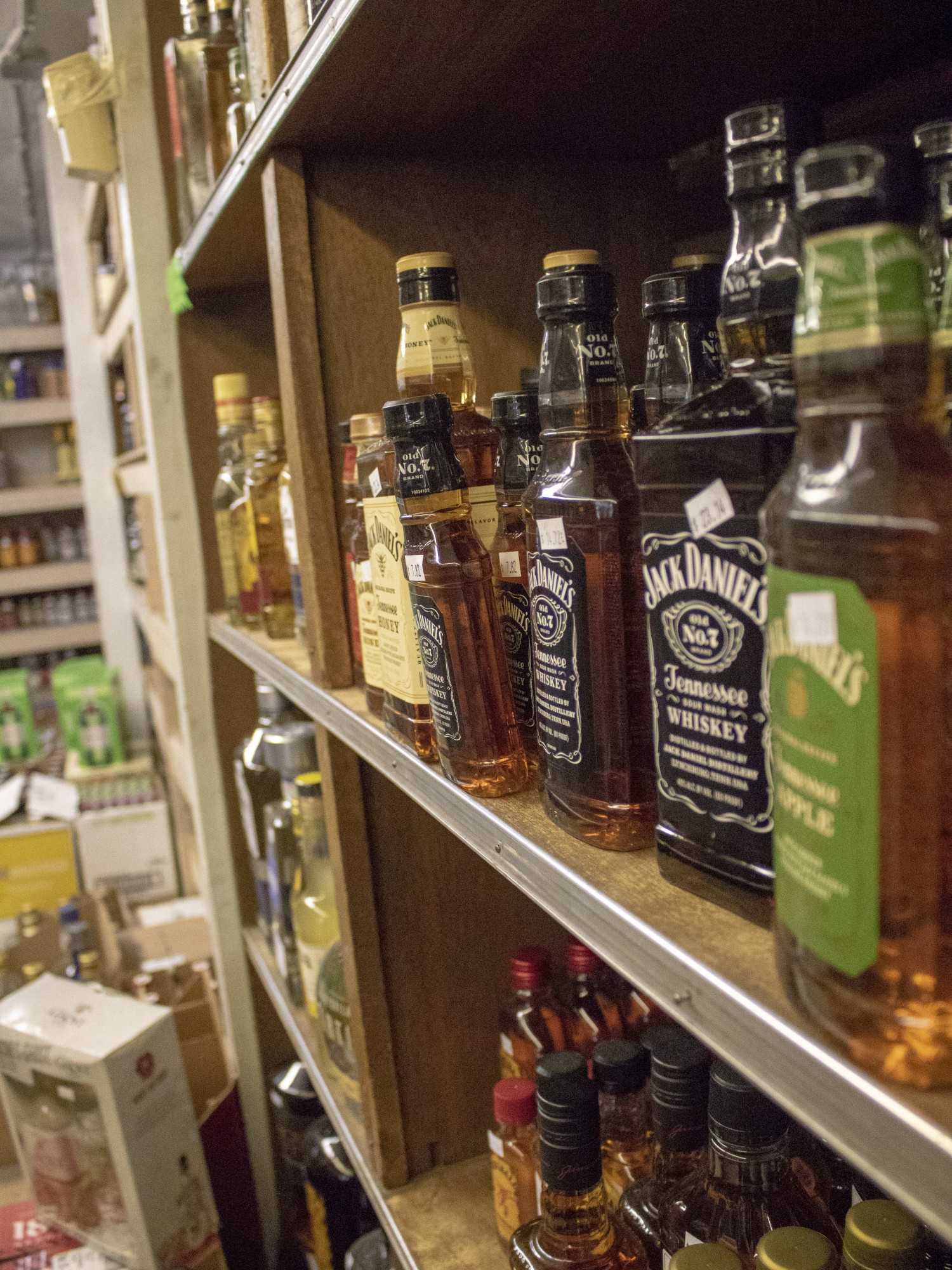 A variety of alcohol sits on the shelf inside of the UA Liquor Store. The UA Liquor store is located on the corner of 6th Avenue and Park Avenue. 