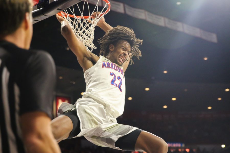 Arizona freshman Zeke Nnaji (22) yells after successfully dunking another ball during the Arizona-New Mexico State game in the McKale Center on Sunday November 17, 2019. 