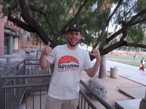 Tyler Anderson is a senior studying agriculture business and economics while serving as president of Elevation Ski and Snowboard Club. Here he shows off the club’s latest shirt and hat apparel on Oct. 10, 2019. 