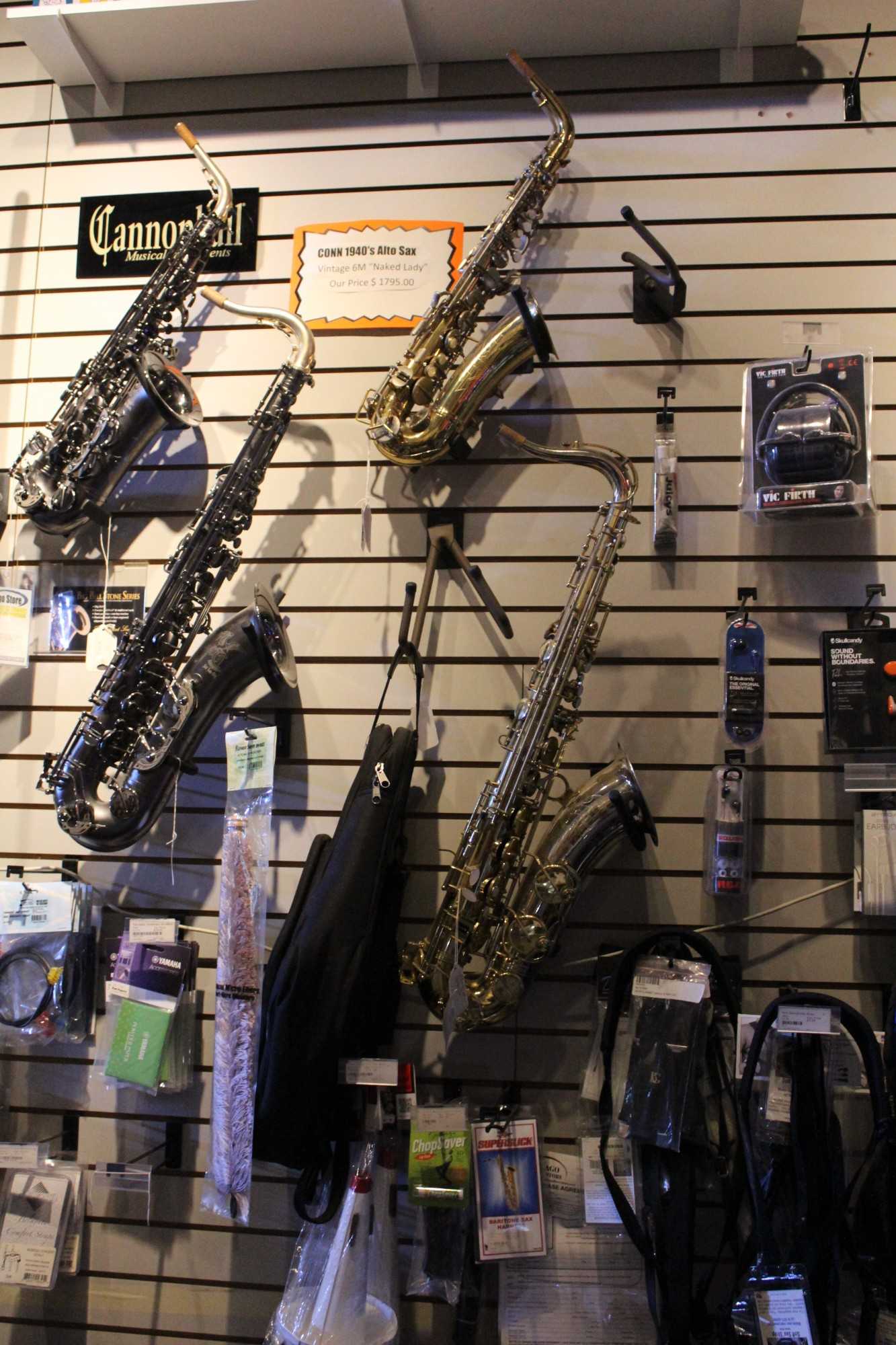 Conn 1940's Alto Sax as well as other saxophones on display.