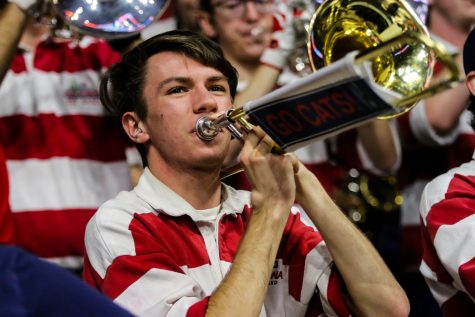 A member of the Pride of Arizona plays the University of Arizona theme song before the start of the men's basketball game. 