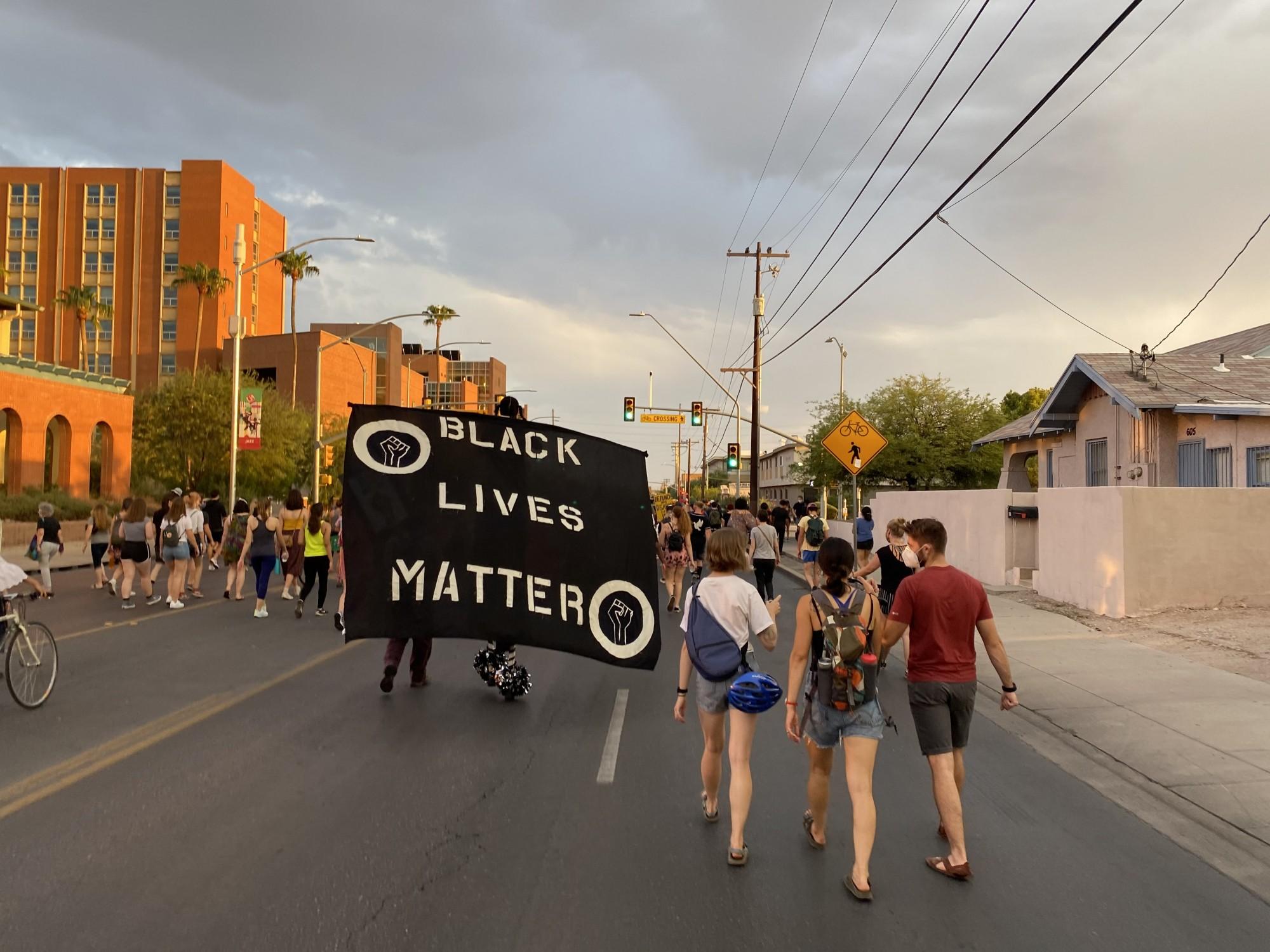 Protestors carry a Black Lives Matter flag during the Coalition of Black Students and Allies rally Aug. 28. 