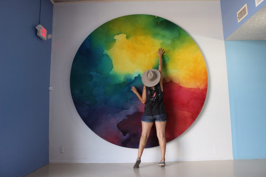  Groundworks is a nonprofit organization for artists and creatives around Tucson. Groundworks lobby with Lauren Cabrera in front of her piece of art. 