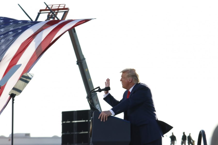 President Donald Trump talking about his election plans to the crowd of people at his campaign rally in Tucson, Ariz., Monday, Oct. 19, 2020. 