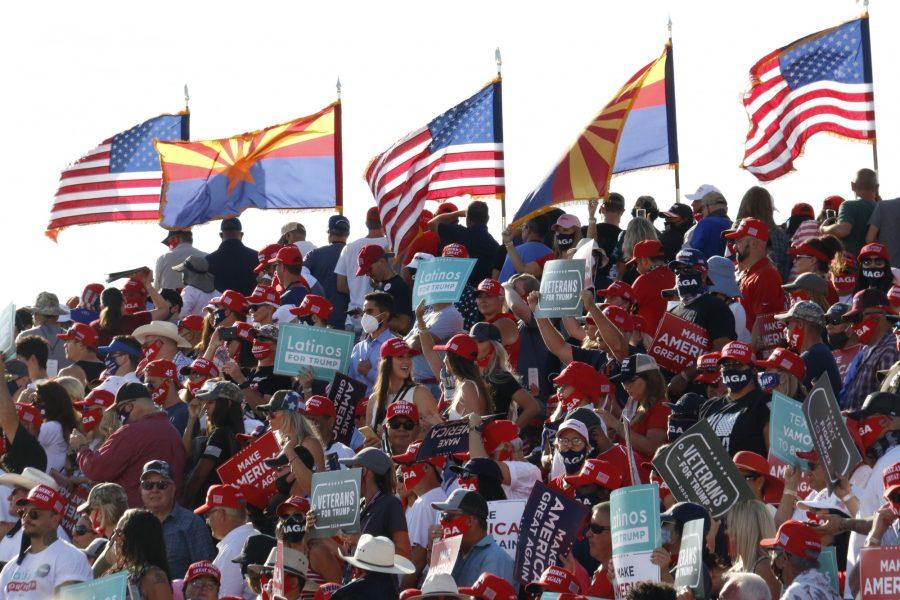 A crowd of people supporting President Donald Trump waiting for the presidents arrival at his campaign rally in Tucson, Ariz., Monday, Oct. 19, 2020. 
