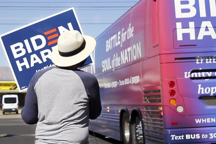 A supporter of the Biden/Harris campaign greets the campaign’s bus with excitement, Friday, Oct. 9, 2020 in Tucson, Ariz. The bus made stops in Yuma and Tucson to share more information about Joe Biden and Kamala Harris’s campaign.