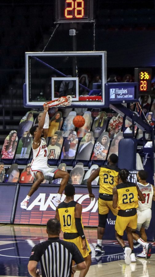 Jordon Brown a Sophomore on the University of Arizona’s Men’s basketball team receives a
pass down the court to dunk on a Grambling State player at the McKale Memorial Center,
Friday, Nov 27, 2020. The Wild Cats went on to win the game 74-55.