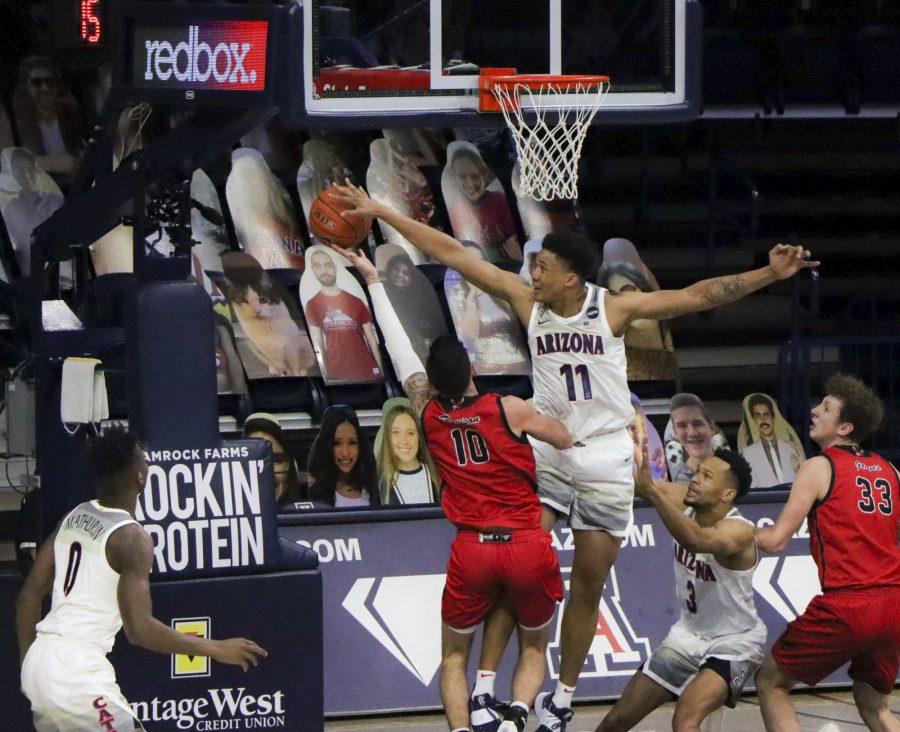 Number 11 Ira Lee a Senior on the University of Arizona’s Men’s basketball team blocks a shot from an Eastern Washington player in the McKale Memorial Center, Saturday, Dec 5, 2020. The WildCats go on to win the game 70-67.